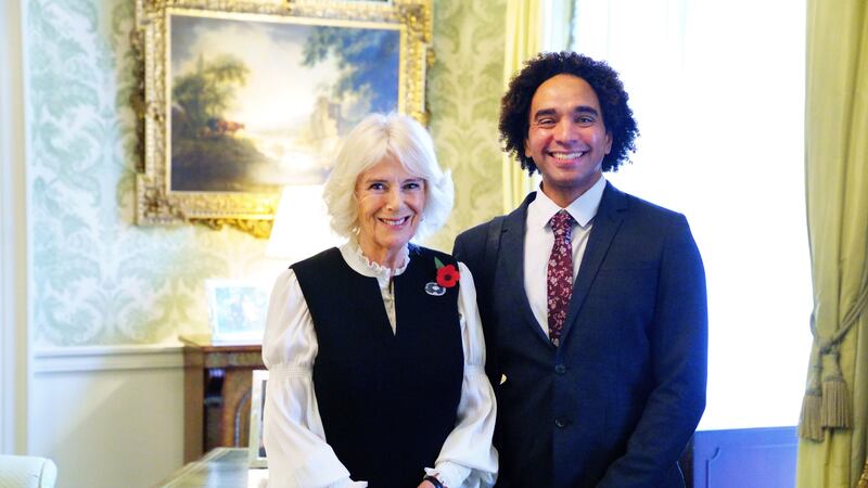 The Queen Consort and Coelho met in the Clarence House library to celebrate World Poetry Day.