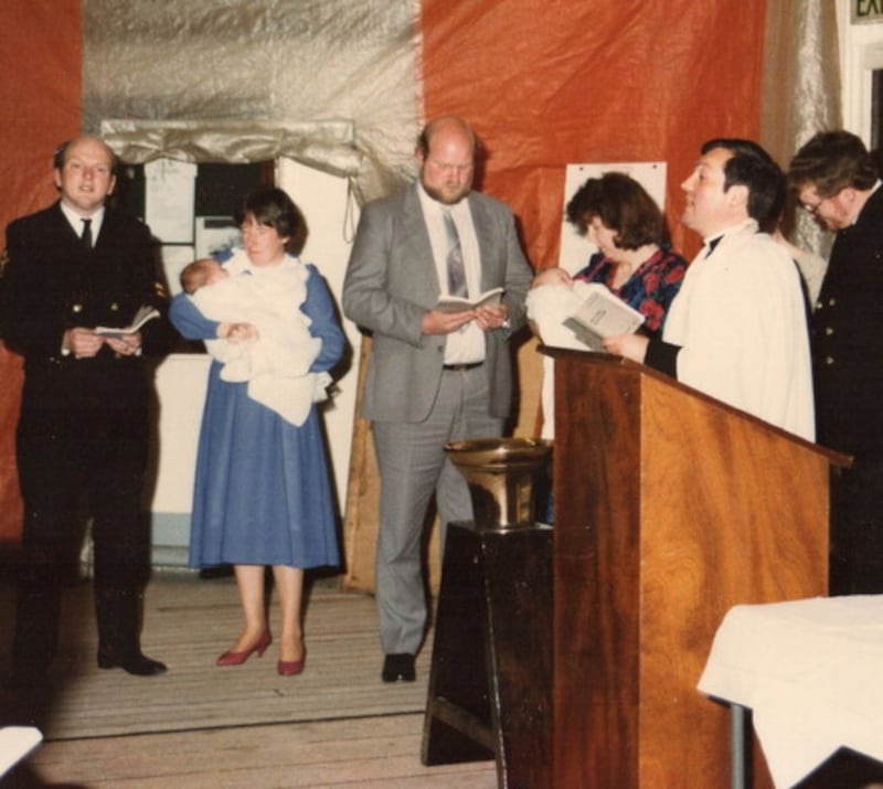 John and his wife Eileen with their daughter Joanne being christened in the bell