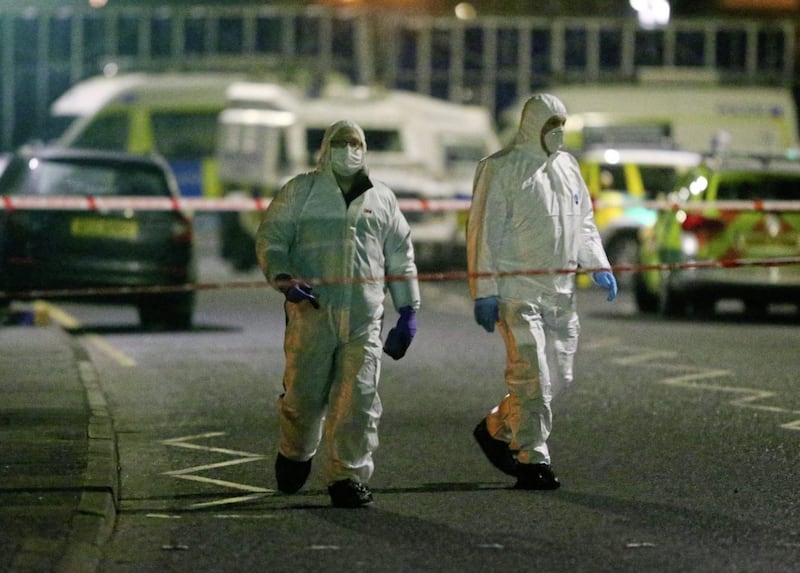 Forensic officers at the scene of a murder on the Glen Road in west Belfast Picture Mal McCann. 