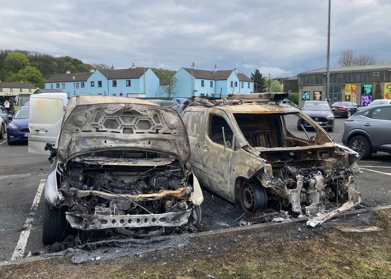 Scene at Bushmills in Co-Antrim where a man had his hands nailed to a fence and two vans were burnt out. Graffiti was also painted on a public toilet block in the popular tourist town close to the Giants Causeway. Picture Margaret Mclaughlin 5-5-2024