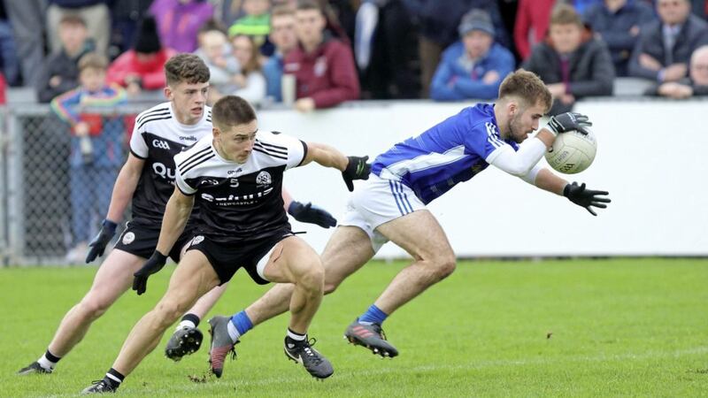 Down Senior GAA Football Championship final: Warrenpoint&#39;s Donagh McAleenan slips past Kilcoo&#39;s Aaron Branagan and Anthony Morgan at Pairc |Esler on Sunday October 13 2019. Picture by Cliff Donaldson. 
