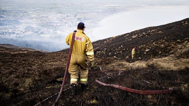 Firefighters tackle a large gorse fire in the Slieve Donard. Picture by Conor Kinahan/Pacemaker Press.. 