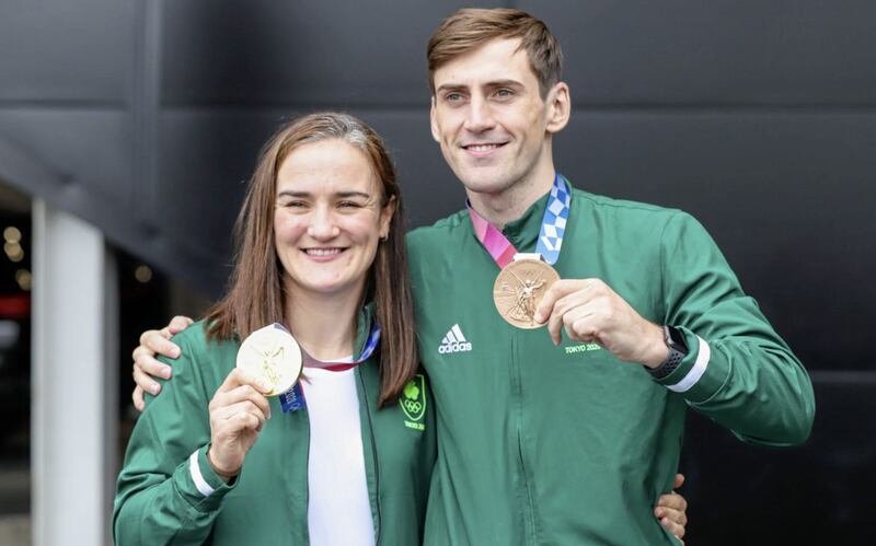 Bronze medallist Aidan Walsh with Kellie Harrington after the Irish team landed at Dublin airport following their Olympic exploits. Picture by PA 