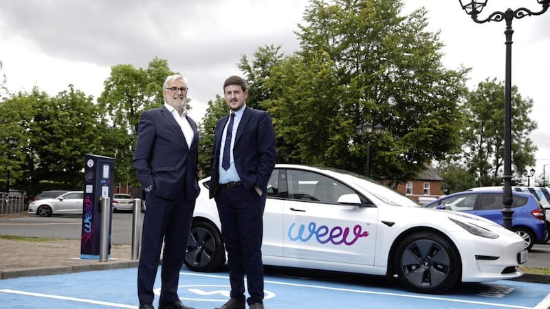 Philip Rainey, chief executive at Belfast-based EV infrastructure company Weev, with Tim Bradley, general manager at the Beechlawn Hotel 