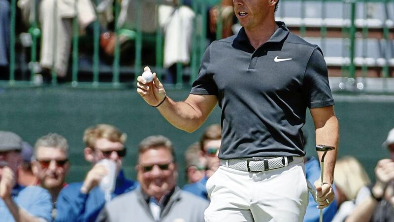 Rory McIlroy reacts after a birdie at his opening hole on day one of the Masters at Augusta 