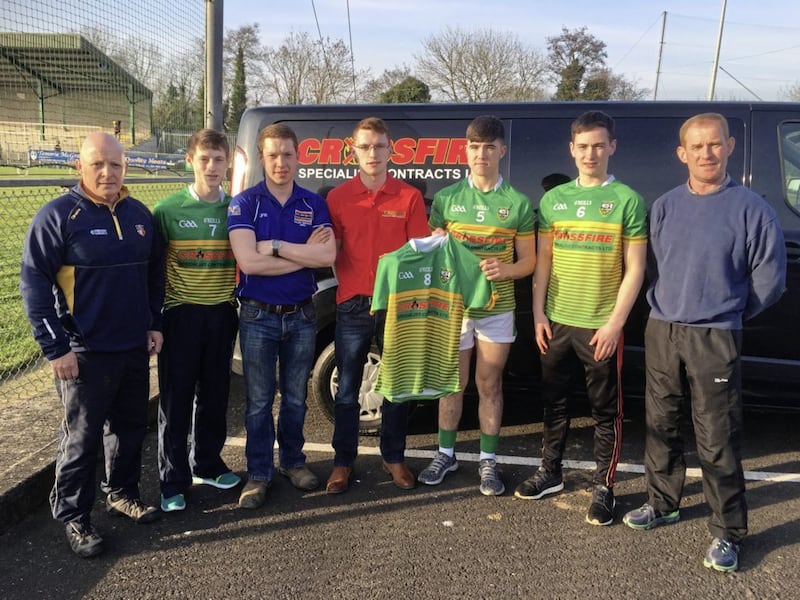 John McGilligan from MFL Garden &amp; Plant Machinery and James McGilligan from Crossfire Specialist Contracts Ltd are pictured presenting new team jerseys to the Watty Graham&#39;s minor footballers 
