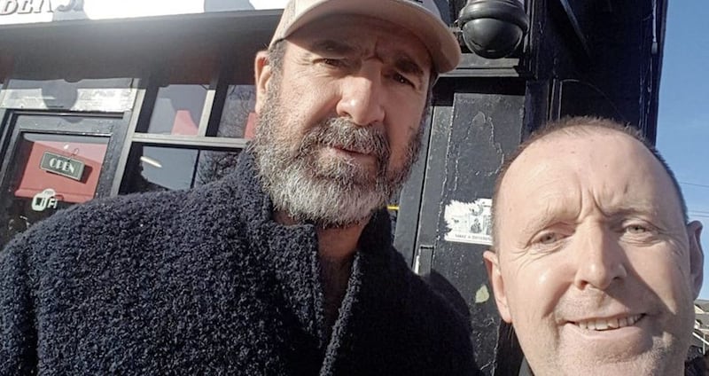 Cantona posing for a selfie on Falls Road in west Belfast 