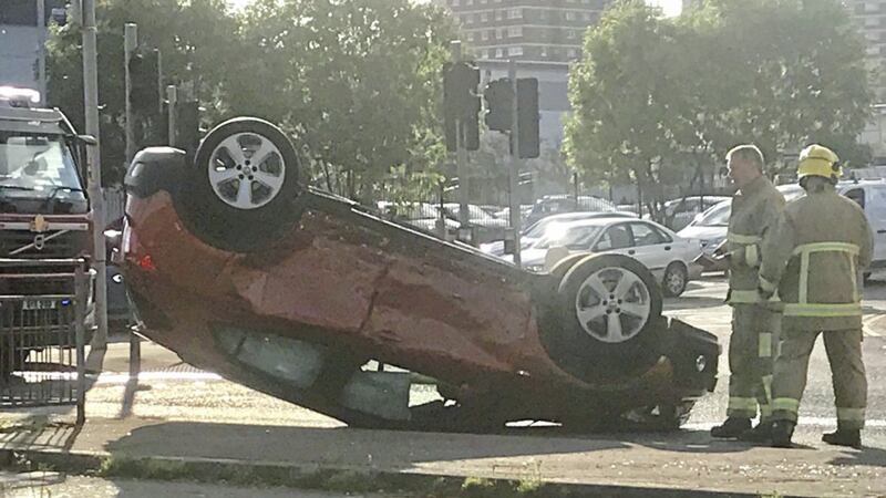 A car ended up on its roof after a two-car collision at the junction of Duncairn Gardens and Brougham Street in Belfast yesterday 