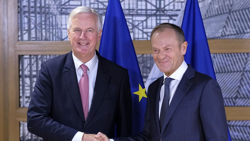 EU chief Brexit negotiator Michel Barnie, left, shakes hands with European Council President Donald Tusk prior their talks at the European Council headquarters in Brussels today&nbsp;
