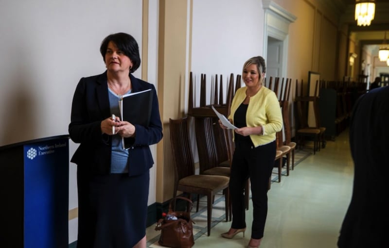 &nbsp;First Minster Arlene Foster (left), and Deputy First Minister Michelle O'Neill in a hallway at Stormont before the Northern Ireland Executive press conference. Picture by Liam McBurney, Press Association