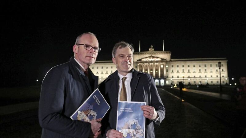 Julian Smith, pictured right alongside Simon Coveney, has proved to be both dogged and determined in putting it up to the Northern Ireland politicians by concluding a deal. Picture by Niall Carson/PA Wire 