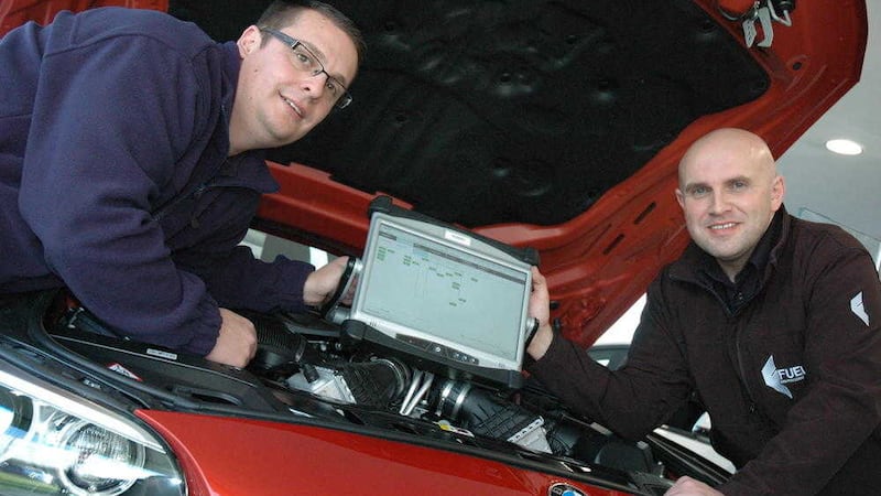 Workers from Fuel set up the new IT infrastructure in David Prentice, designed and supplied by BMW Germany, to deal with the new IoT technology included in all new BMWs 