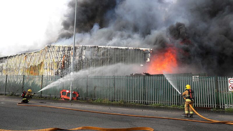 Firefiighters from seven appliances are tacking the blaze at Wastebeater in Kennedy Way industrial estate, west Belfast. PICTURE: Declan Roughan
