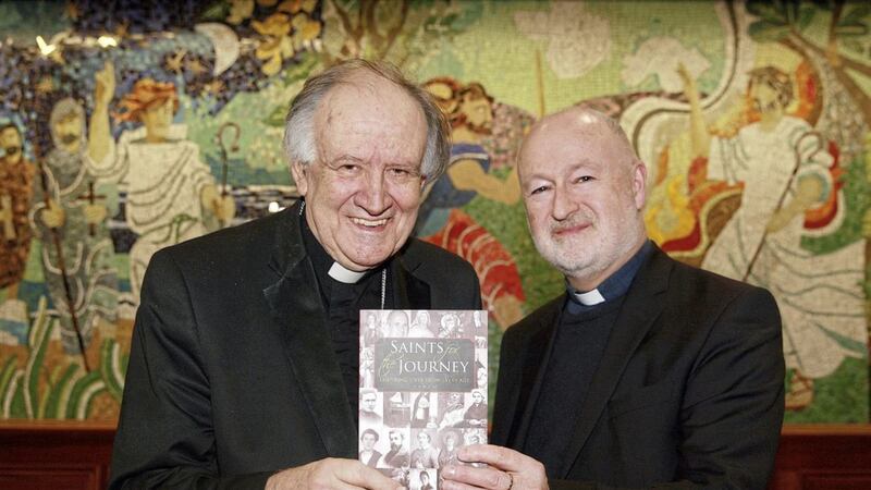 Bishop Emeritus Anthony Farquhar, pictured left, helps Fr John Murray launch the Downpatrick priest&#39;s book Saints for the Journey - Inspiring Lives from Every Age. Picture by Bill Smyth. 