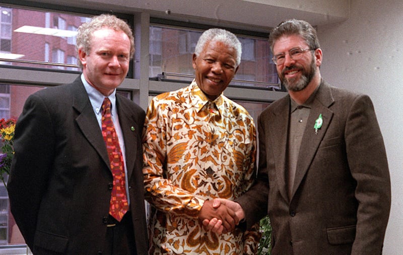 Photo dated 12/4/2000 of former South African President Nelson Mandela meets Martin McGuinness (L) and Gerry Adams at the South African Embassy in Dublin&nbsp;