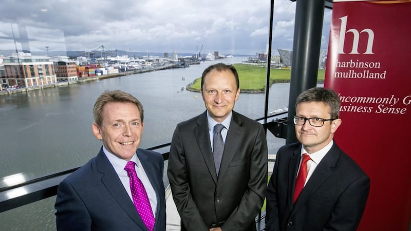 William Barnett (centre) of W &amp; R Barnett, who took the number one spot for the second year in a row in Northern Ireland&#39;s NI Top 100 Family and Owner Managed Businesses. Also pictured are Michael McQuillan, director Ulster University Business School (left) and Darren McDowell, partner Harbinson Mulholland (right) 