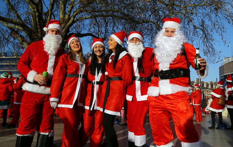 People in Santa costumes