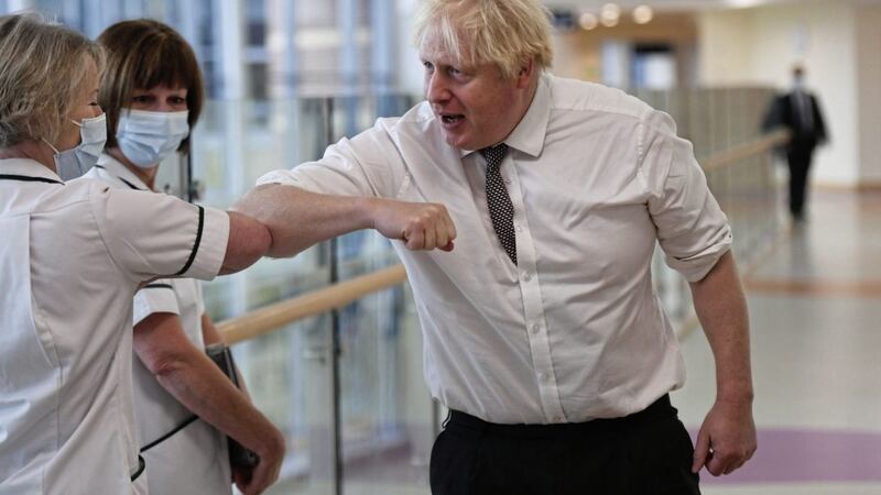 Prime Minister Boris Johnson spent Monday visiting a hospital in Northumberland, where he milled around pointlessly, elbow-bumping staff until he was reminded to put on a face mask. Picture by Peter Summers/PA Wire 