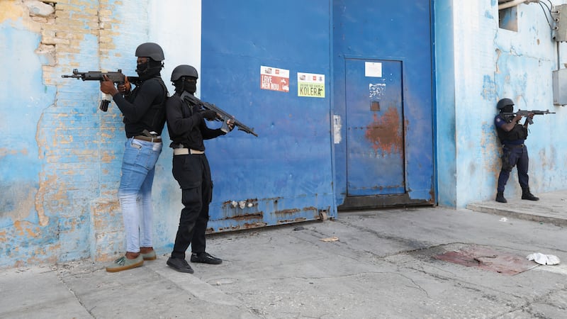 Police stand guard outside the National Penitentiary in Port-au-Prince, Haiti (Odelyn Joseph/AP)