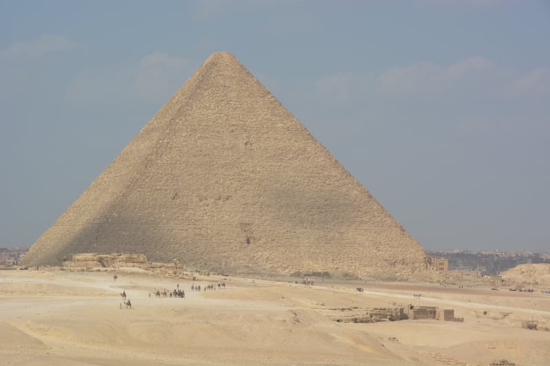 One of the pyramids of Giza pointing to the heavens from the desert at the edge of Cairo