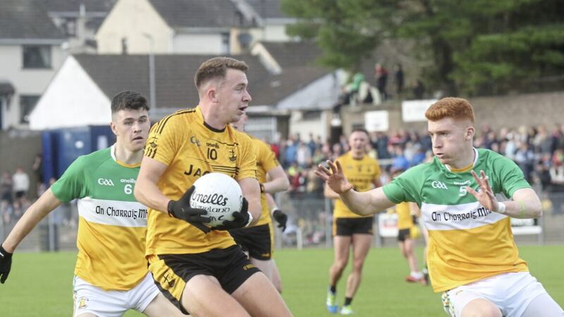 Carrickmore&#39;s Rory Donnelly and Niall Allison put pressure on Loughmacrory&#39;s Pauric Meenagh during Saturday&#39;s Tyrone SFC quarter-final at Pomeroy Picture: Jim Dunne 