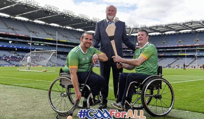 Martin Donelly, Sponsor, with GAA International Wheelchair captain Pat Carty, right, and vice-captain James McCarthy