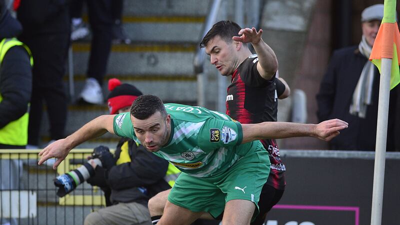 Crusaders midfielder Philip Lowry tangles with Colin Coates of Cliftonville during the sides' St Stephen's Day meeting. Picture by Pacemaker