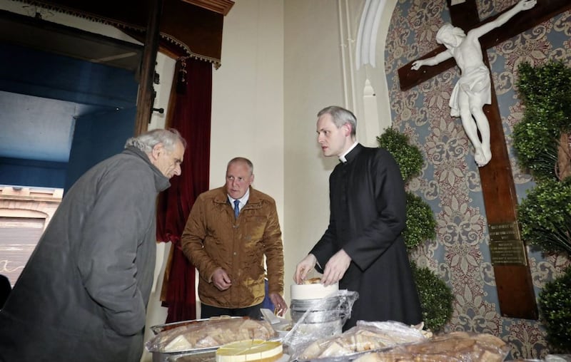 Fr Dominic McGrattan and Lenny Craig provide some food to the homeless. Picture by Declan Roughan 