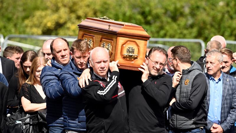 Former Tyrone players from the 1995  and 1986 teams in All Ireland finals Feargal Logan (present Tyrone Manager) , Jody Gormley, Mickey Moynagh and Mickey McClure carry the coffin of Art McRory during his funeral at St Patrick's Church in Dungannon                          Picture: Oliver McVeigh