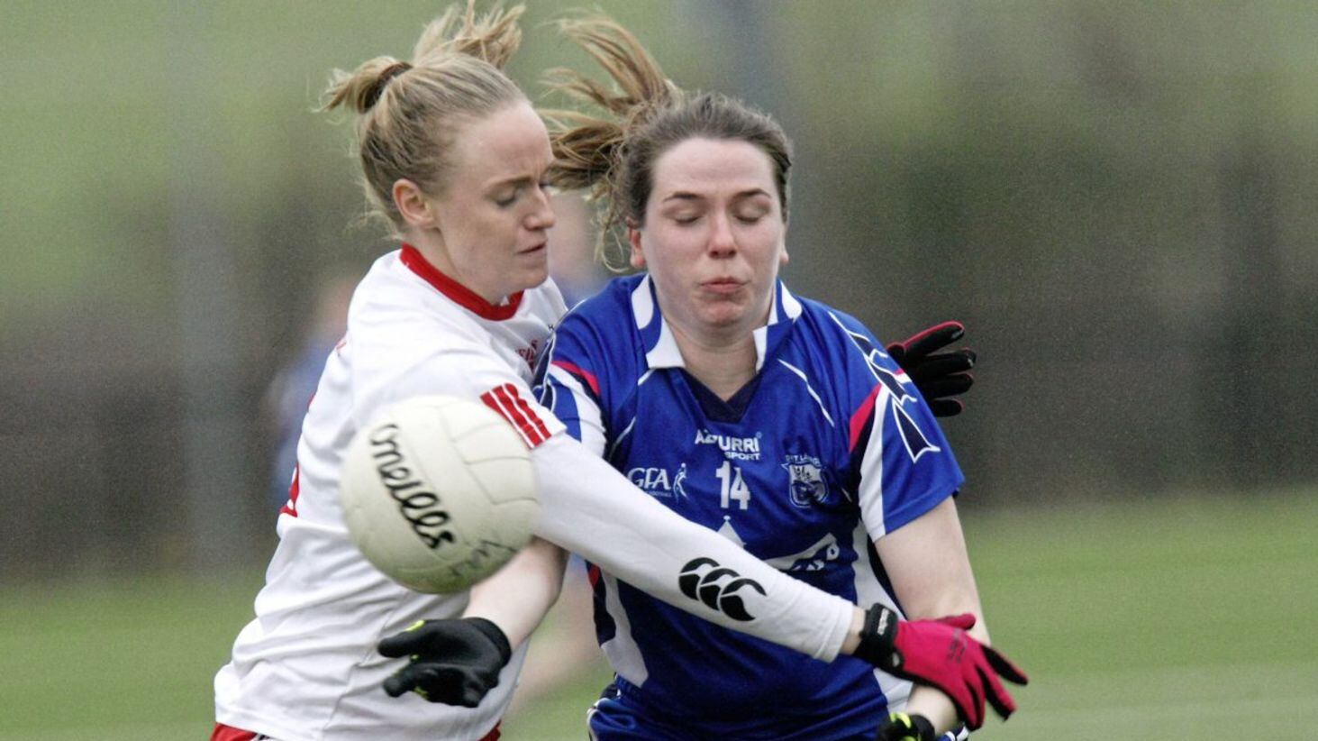 Tyrone&#39;s Neamh Woods (left) tackles Waterford&#39;s Eimear Fennell 