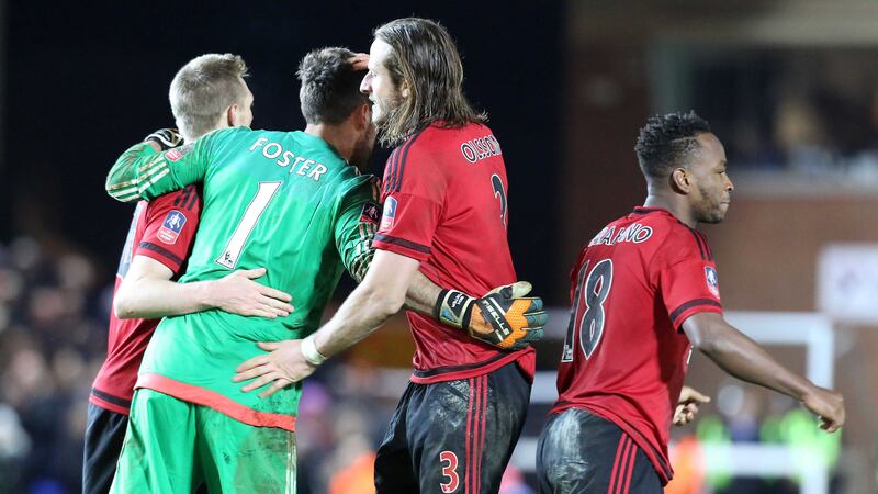 West Bromwich Albion goalkeeper Ben Foster is congratulated by his team-mates after his heroics in Wednesday's FA Cup fourth round replay shoot-out against Peterborough at the ABAX Stadium<br />Picture by PA