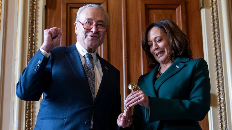 Senate Majority Leader Chuck Schumer presents Vice President Kamala Harris with a golden gavel (Stephanie Scarbrough/AP)
