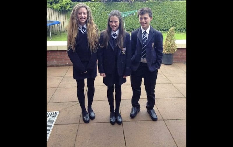 &nbsp;Methody pupil Olivia Neill (centre) with her brother Matthew and sister Emma
