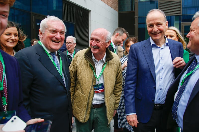 Former Taoiseach Bertie Ahern meets current Fianna Fail leader and Tanaiste Micheal Martin as he arrives at the Fianna Fail Ard Fheis