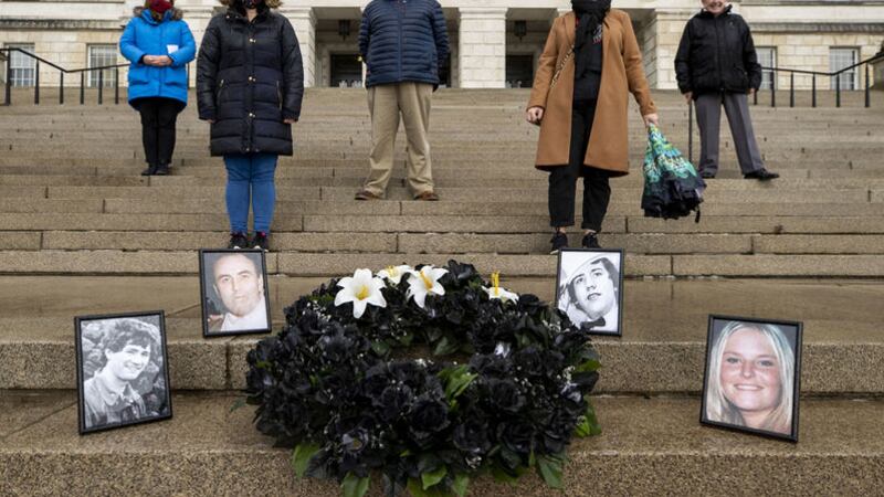 (left to right) Sheila Simons, sister of Eugene Simon, Susie Townsley, daughter of Jean McConville, Oliver McVeigh, brother of Columba McVeigh, Michelle Dorrian ,sister of Lisa Dorrian, Gerry McGinley, brother law of Peter Wilson, stand by a black wreath with white lilies representing those who have yet to be found and photos of the victims (left to right) Captain Robert Laurence Nairac, Joe Lynskey, Columba McVeigh, and Lisa Dorrian, on steps of Parliament Buildings, during a silent walk for the Disappeared at Stormont on the 14th annual All Souls Silent Walk. Picture by Liam McBurney/PA Wire&nbsp;