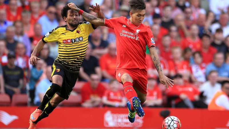 Watford's Ikechi Anya is helpless as Liverpool's Roberto Firmino lets fly to score Liverpool's second at Anfield on Sunday<br />Picture by PA
