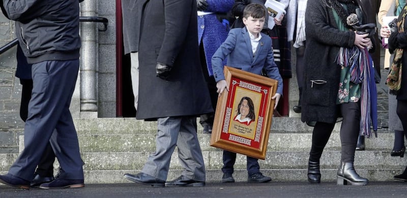 A young boy carrys a picture of Bobby Sands at the funeral of Rosaleen Sands the mother of Bobby Sands at St Oliver Plunkett&#39;s Church, Blackrock Co Louth Picture Mal McCann. 