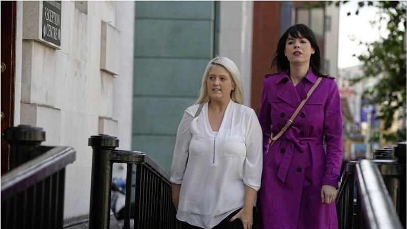 Sarah Ewart left and Grainne Teggart on the wayinto the High Court in Belfast yesterday picture hy Hugh Russell. 