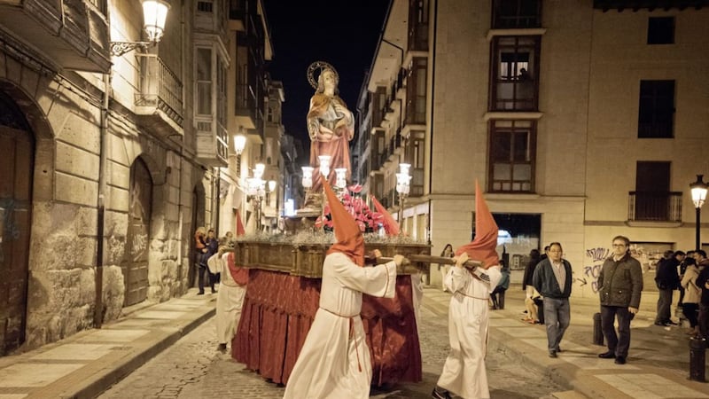 In six weeks&#39; time, during Holy Week, the penitentes, wearing capes and hoods, will carry a holy statue on the big wooden table through the streets 