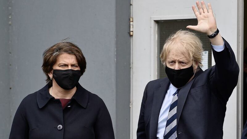 Prime Minister Boris Johnson alongside First Minister Arlene Foster as he leaves the Lakeland Forum vaccination centre in Enniskillen. 