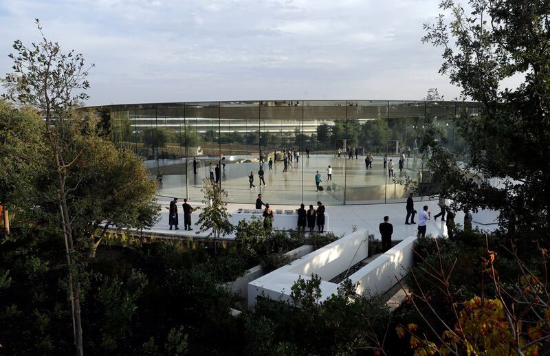People arrive for a new Apple announcement at the Apple Park