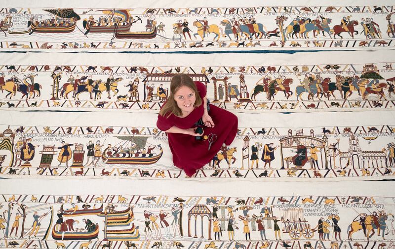Mia Hansson, 47, of Wisbech, Cambridgeshire, with some of her full-size replica of the Bayeux Tapestry, which she is more than halfway through making. (Joe Giddens/ PA)