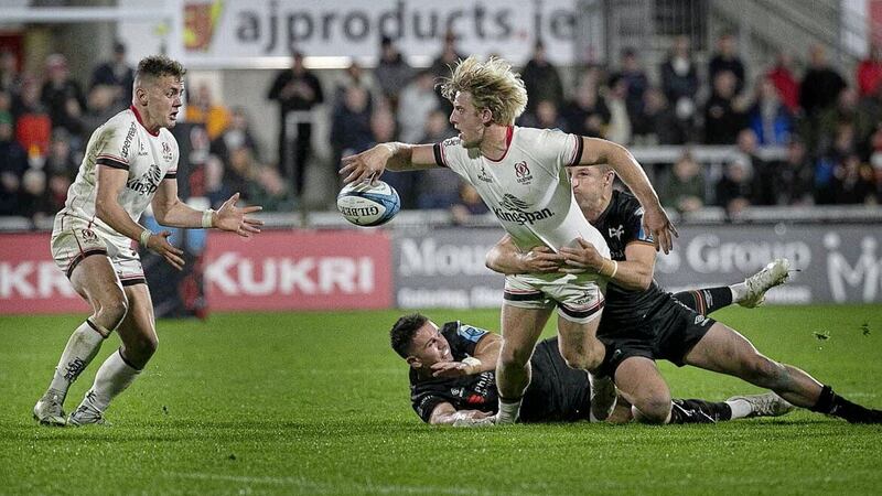 Ulster's Rod Lyttle offloads the ball to Michael Lowry during Ulster's win over Ospreys 			Picture: Hugh Russell. 