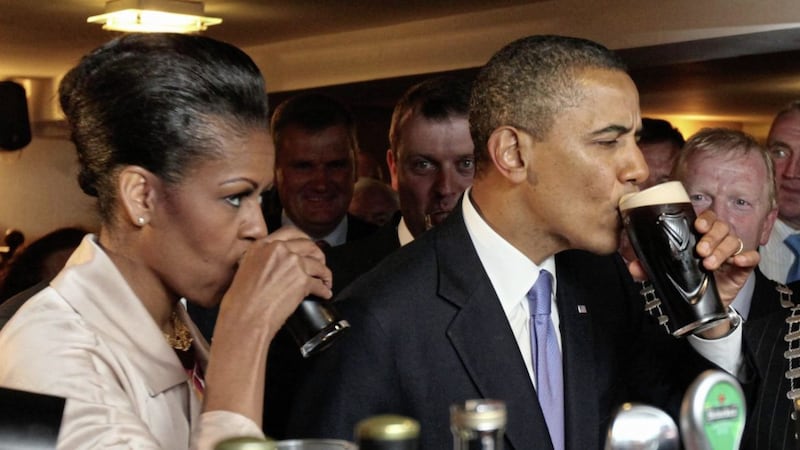 Guinness sales are up in Ireland by 4 per cent, but Diageo Northern Ireland Ltd has reported a fall in profits over the year. Barack and Michelle Obama enjoy a pint of Guinness on their visit to Ireland in 2011. Picture by PA 