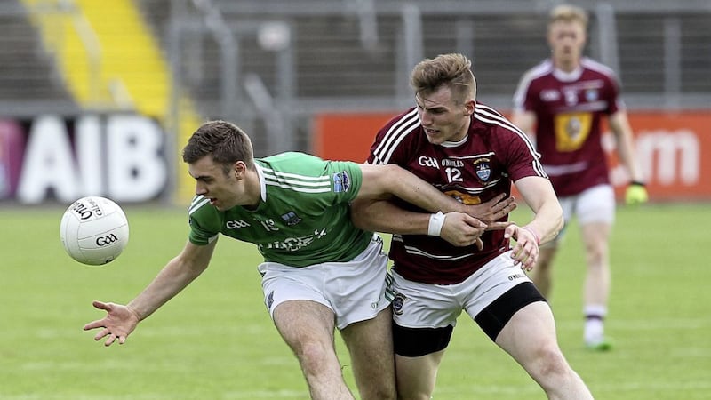 Conall Jones of Fermanagh up against Westmeath's Kieran Martin in the 2015 Championship.<br /> Pic Philip Walsh