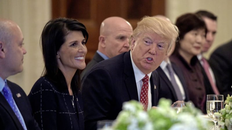 President Donald Trump sitting next to US Ambassador to the UN Nikki Haley at a working lunch with ambassadors of countries on the United Nations Security Council and their spouses last week, in the State Dining Room of the White House in Washington PICTURE: Susan Walsh/AP 