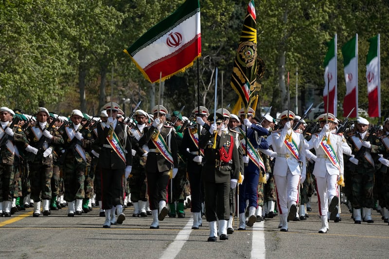 Iranian army members march during an Army Day parade at a military base in northern Tehran (Vahid Salemi/AP)