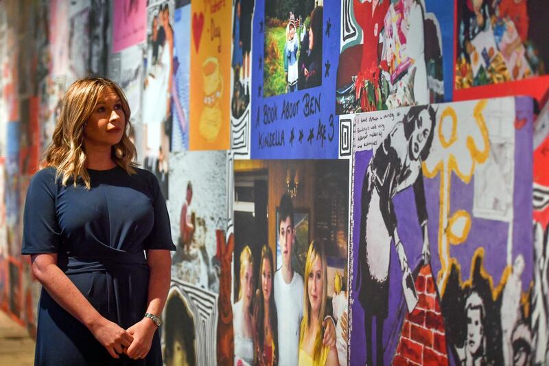 Brooke Kinsella next to a mural dedicated to her brother Ben.