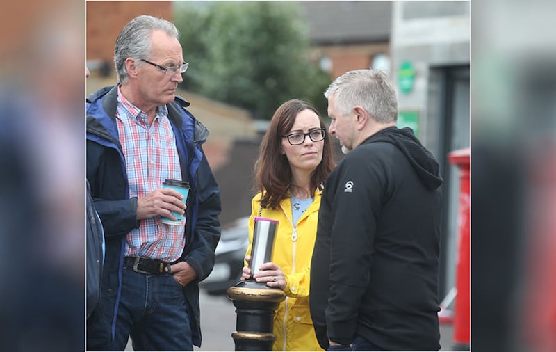 Sinn F&eacute;in MLA Gerry Kelly and SDLP MLA Nichola Mallon speaking to Fr Gary Donegan at Ardoyne, north Belfast. Picture by Hugh Russell