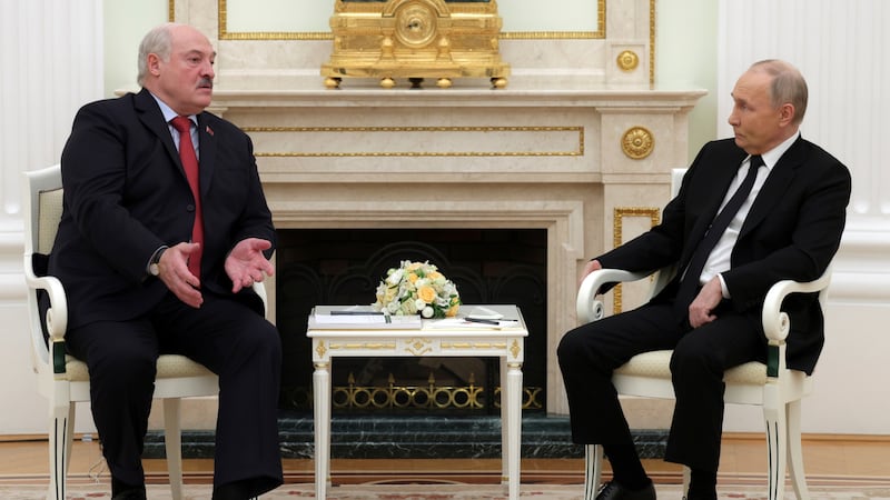 Russian President Vladimir Putin, right, listens to Belarus President Alexander Lukashenko during their meeting at the Kremlin in Moscow, Russia (Gavriil Grigorov/AP)
